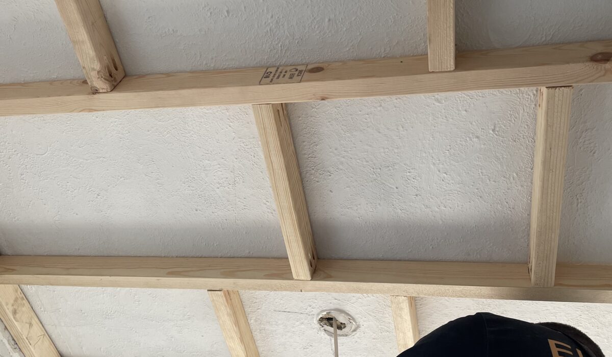 Construction of false ceiling to provide a level, sturdy and lower platform to plasterboard and fit the new ceiling panels onto