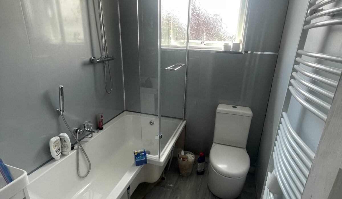 Bath, sink, shower, shower screen, towel rail and toilet all installed