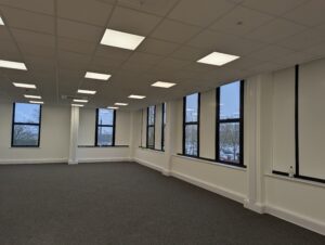 Alternative shot of ceiling panel lights including skirting trunking and drops