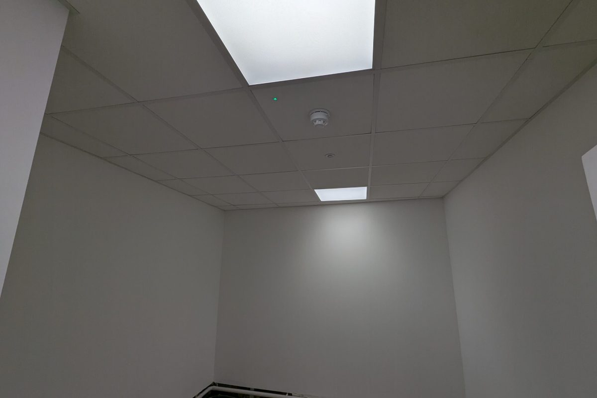 Shot of break room, with PIR sensor flush in ceiling tiles along with controlled LED panel lights